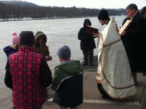 Father Michael Demko blessing the waters